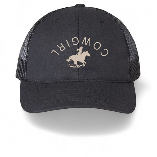 Americana black trucker hat with breathable mesh back and a white cowgirl graphic on the structured front panel.