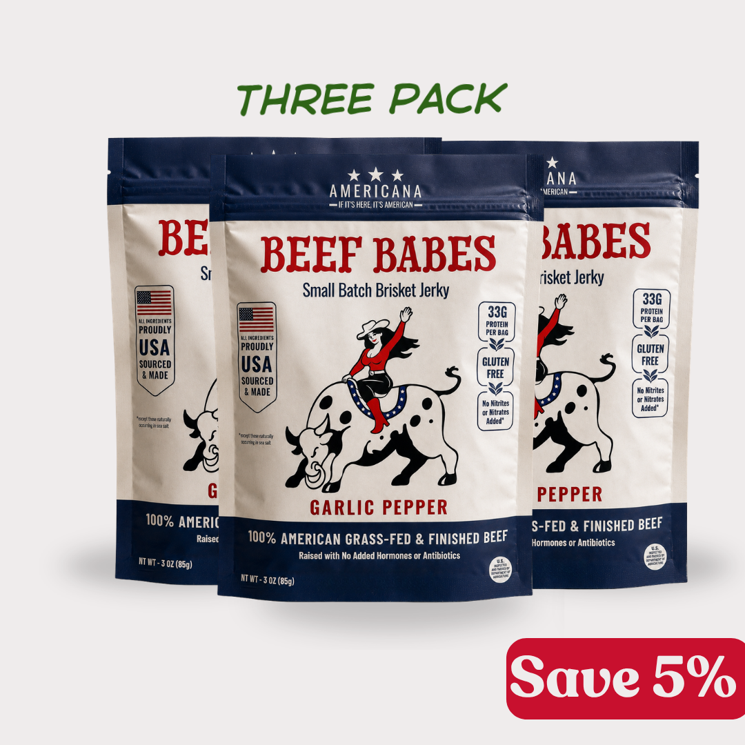 Three stand-up pouches of Americana Beef Babes Garlic Pepper small batch brisket jerky.