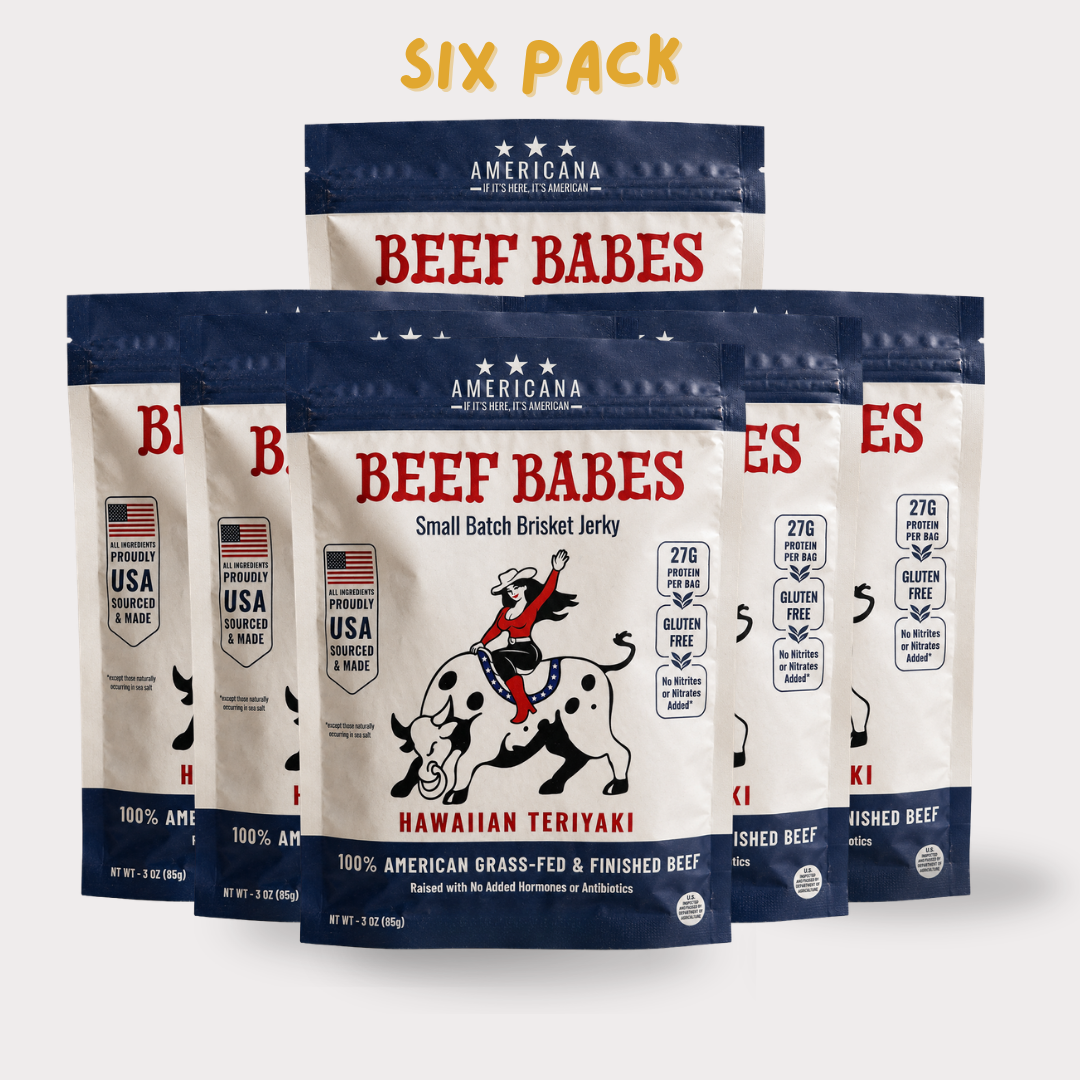 Six bags of Americana Beef Babes Hawaiian Teriyaki brisket jerky arranged in a group on a light gray background, with a yellow 'SIX PACK' text overlay at the top.