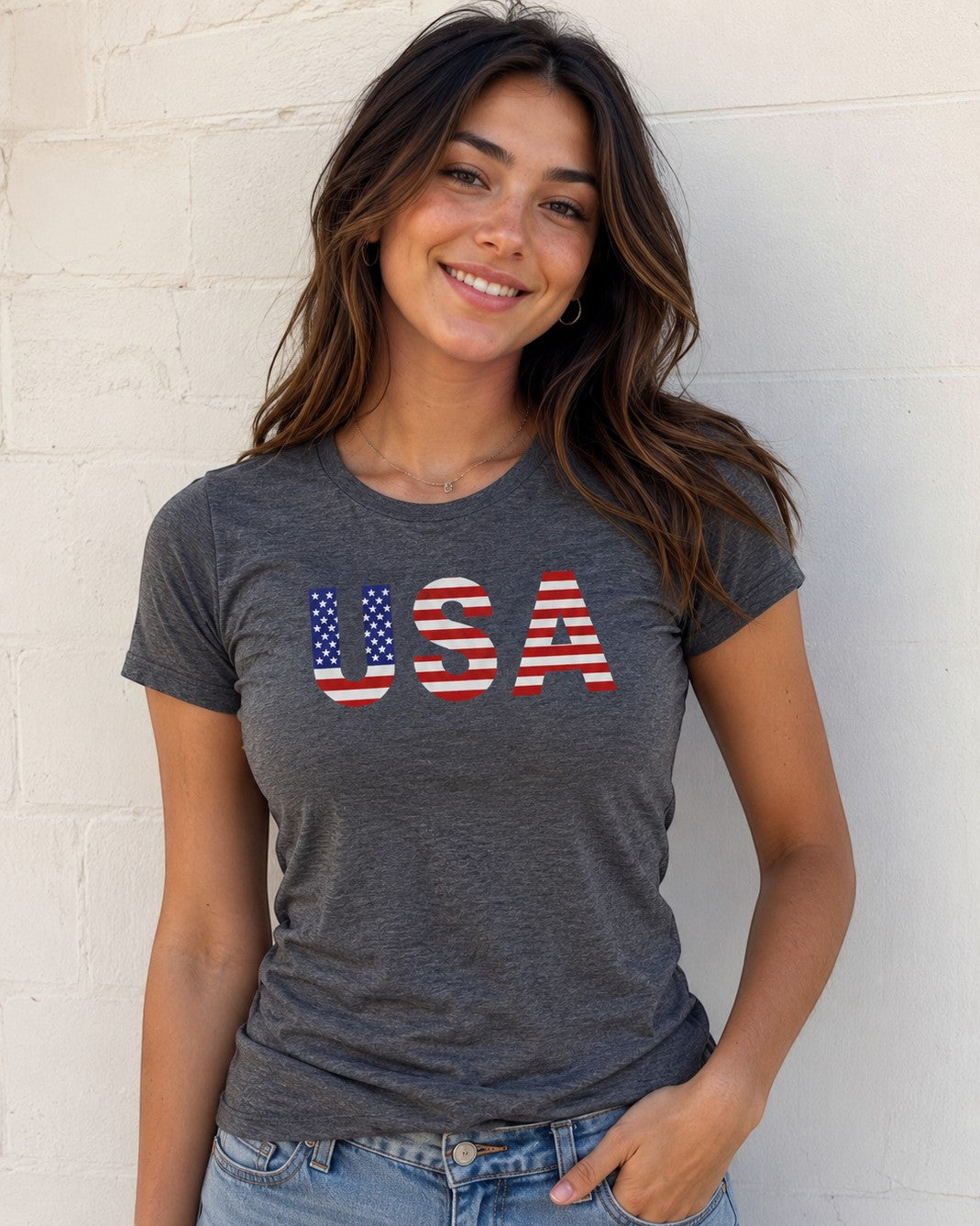Americana charcoal heather crewneck t-shirt with a red, white, and blue USA stars and stripes graphic on a woman.