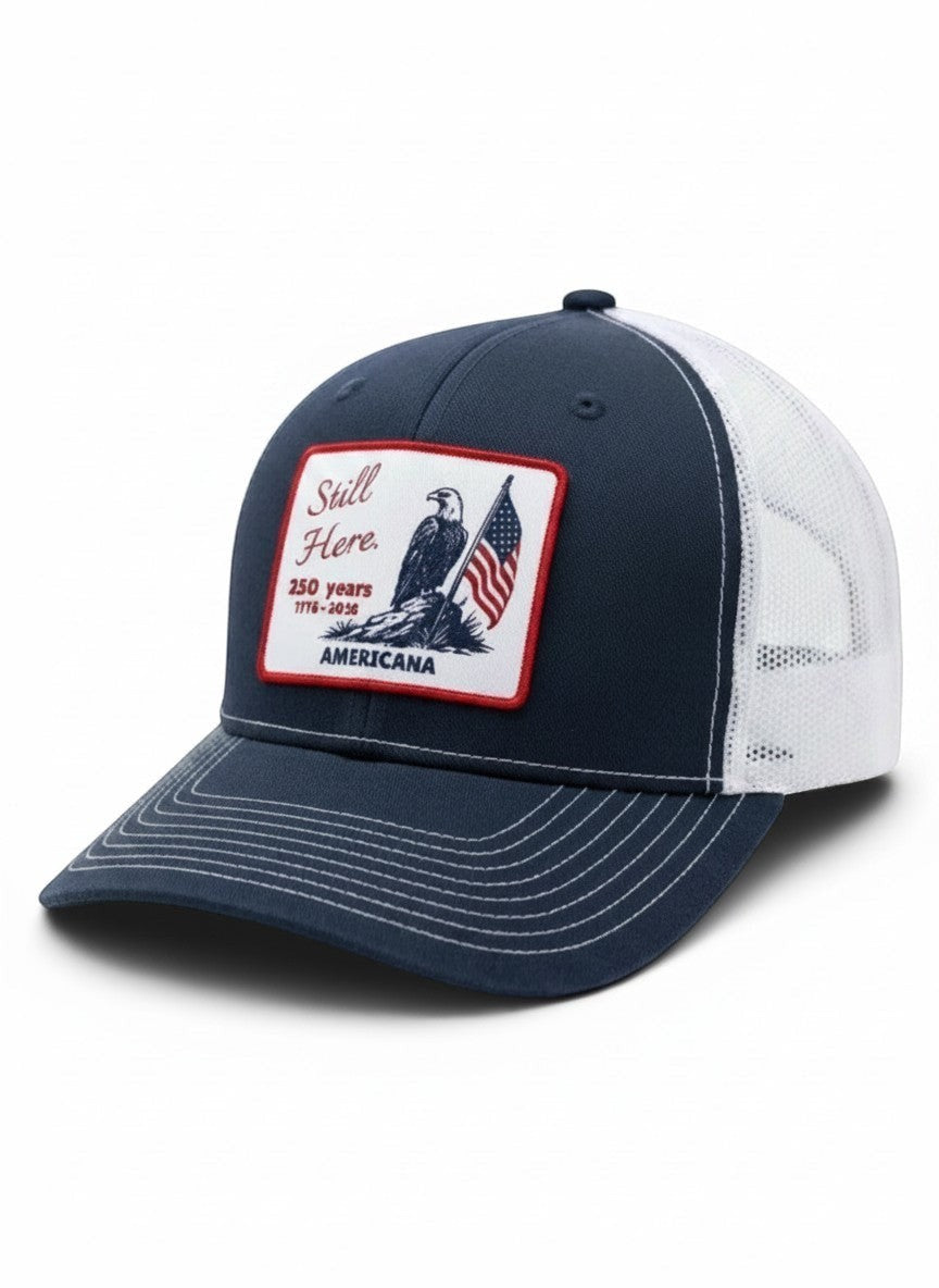 Americana navy blue trucker hat with white mesh back and patriotic eagle and flag patch on front panel